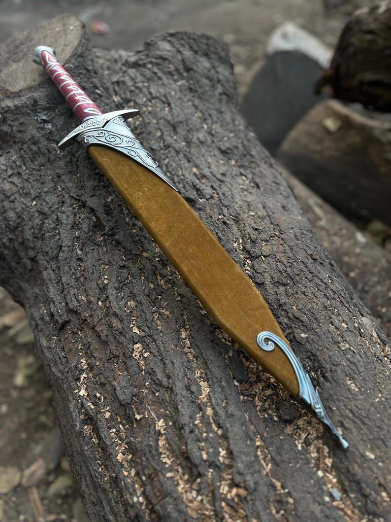 Elven Sword with Intricate Blade and Red Leather-Wrapped Handle