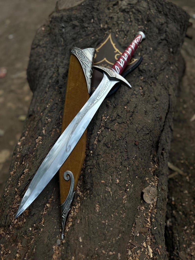 Elven Sword with Intricate Blade and Red Leather-Wrapped Handle